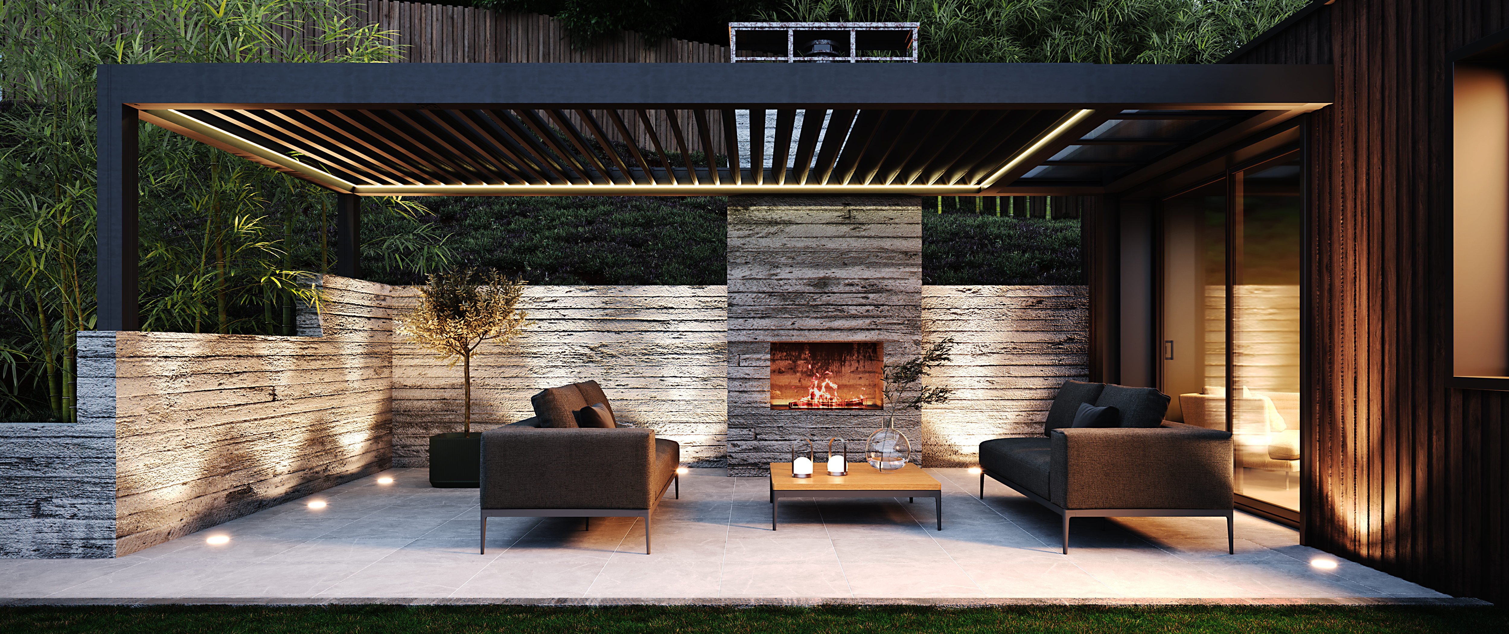 Pergola LUXAIA en hiver avec une cheminée allumée de nuit.